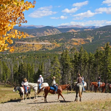 People horseback riding near Breckenridge in the fall