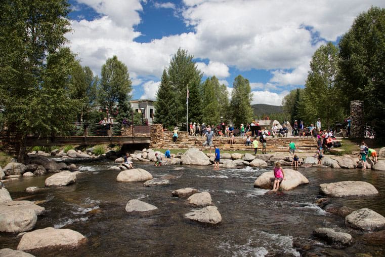 kids playing in the river in Breckenridge