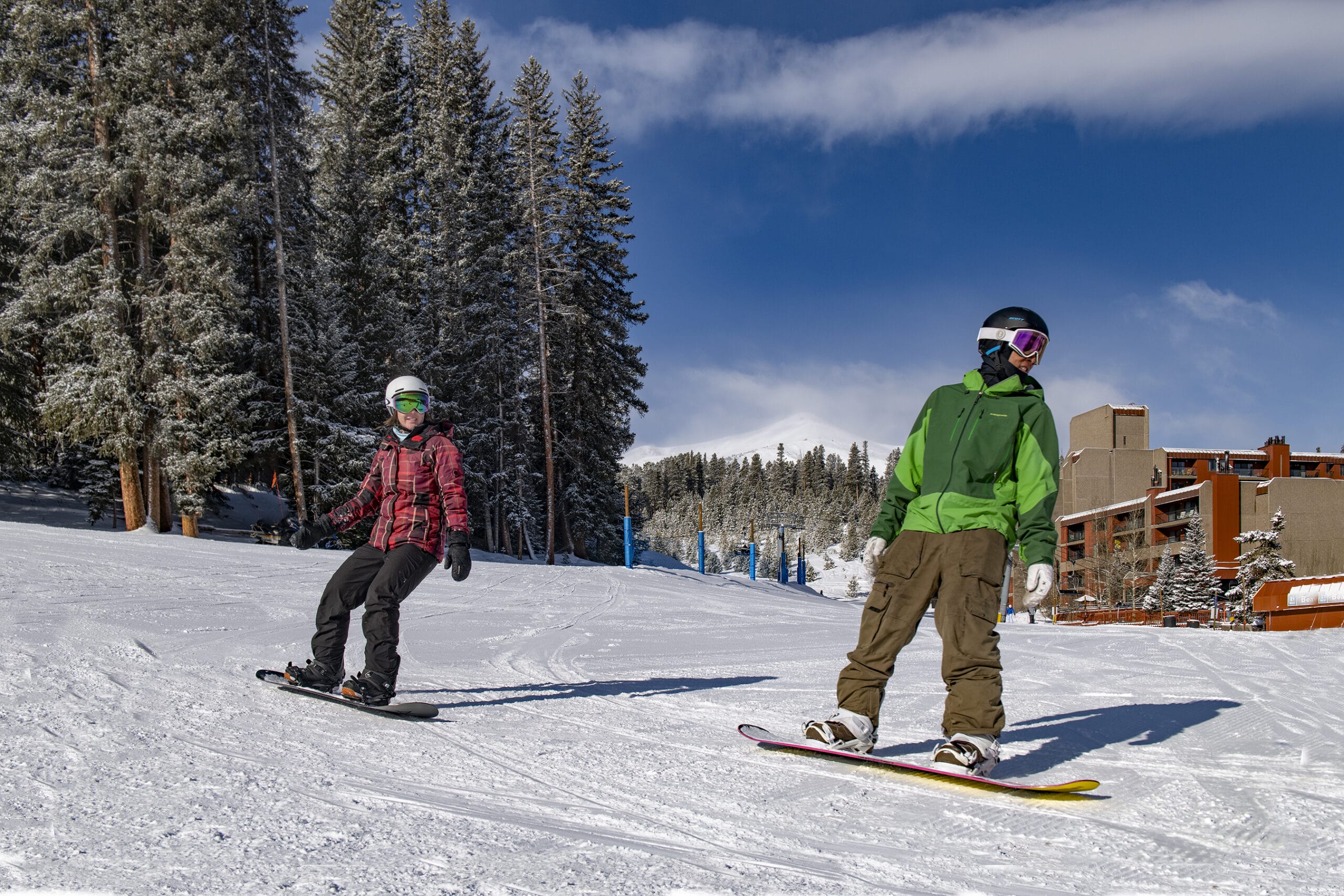 snowboarders riding by Beaver Run