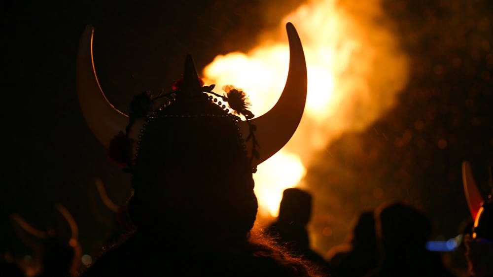 person in Ullr hat at the Ullr Bonfire