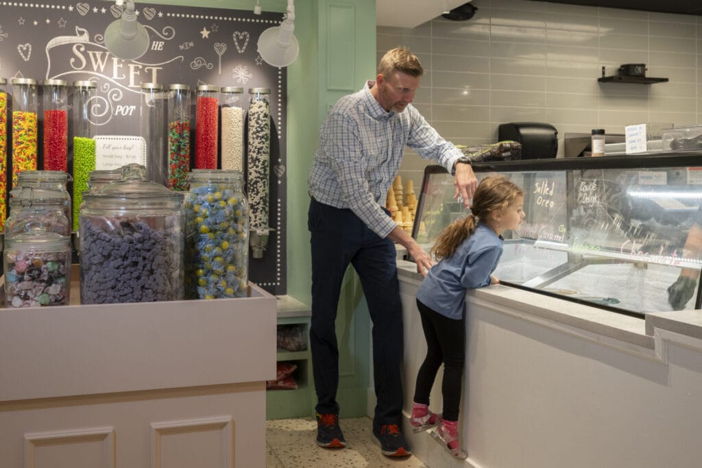 Dad and daughter at the Skywalk Candy Corner