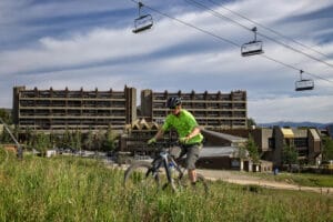 Beaver Run Resort and biker in summer