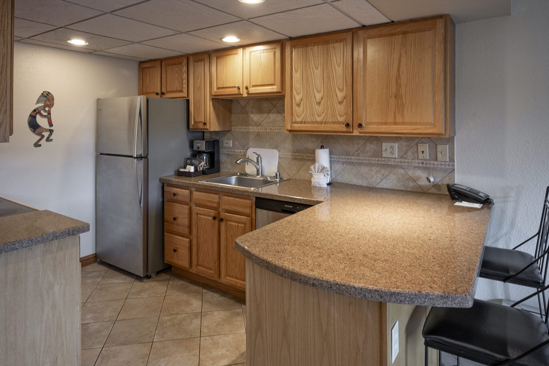 One bedroom suite kitchen with wooden cabinets