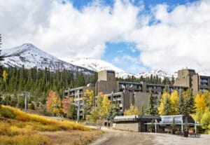 Beaver Run Building 4 fall exterior shot with snow on mountain tops