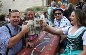 Oktoberfest people cheersing at a table