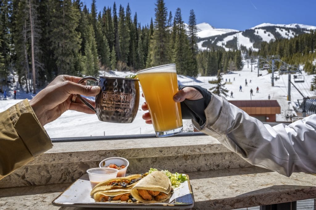 people cheersing during apres at coppertop