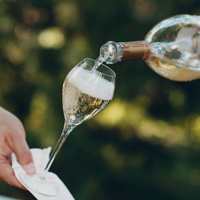 champagne being poured into a glass