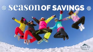 Season of Savings skiers jumping in air